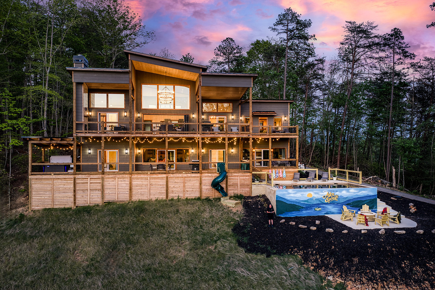 Mountain cabin and pool glowing at sunset, short-term rental twilight photography in North Georgia