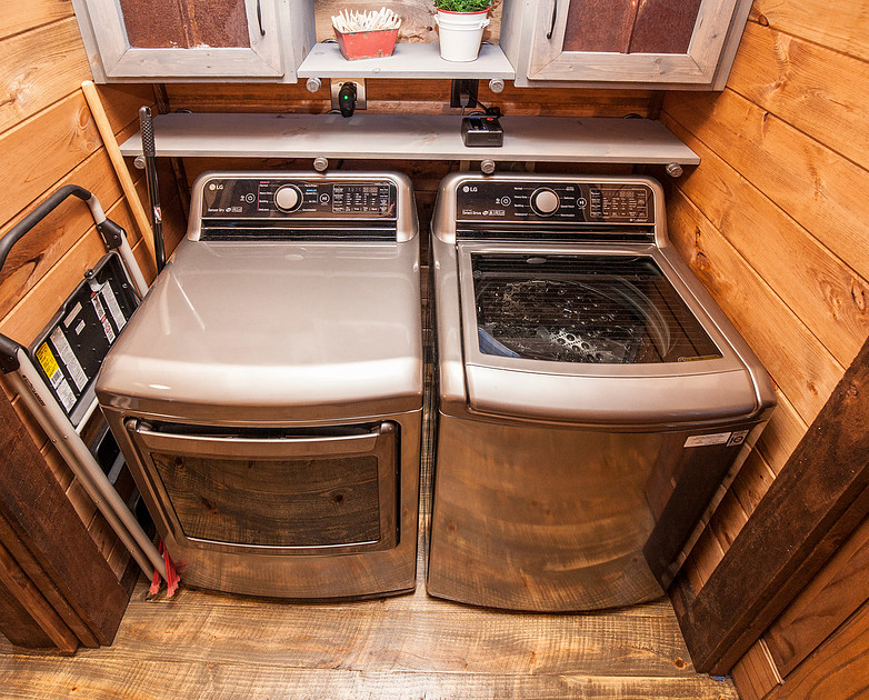 Laundry room with a front-load washer and dryer, real estate photography in North Georgia