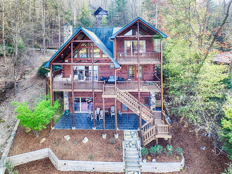 Aerial drone view of a mountain cabin and decks, real estate photography in North Georgia