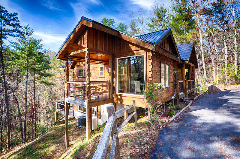 Exterior of a log cabin among the trees, real estate photography in North Georgia
