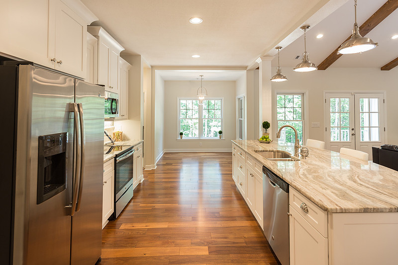 Kitchen with stainless appliances and hardwood floors, real estate photography in North Georgia