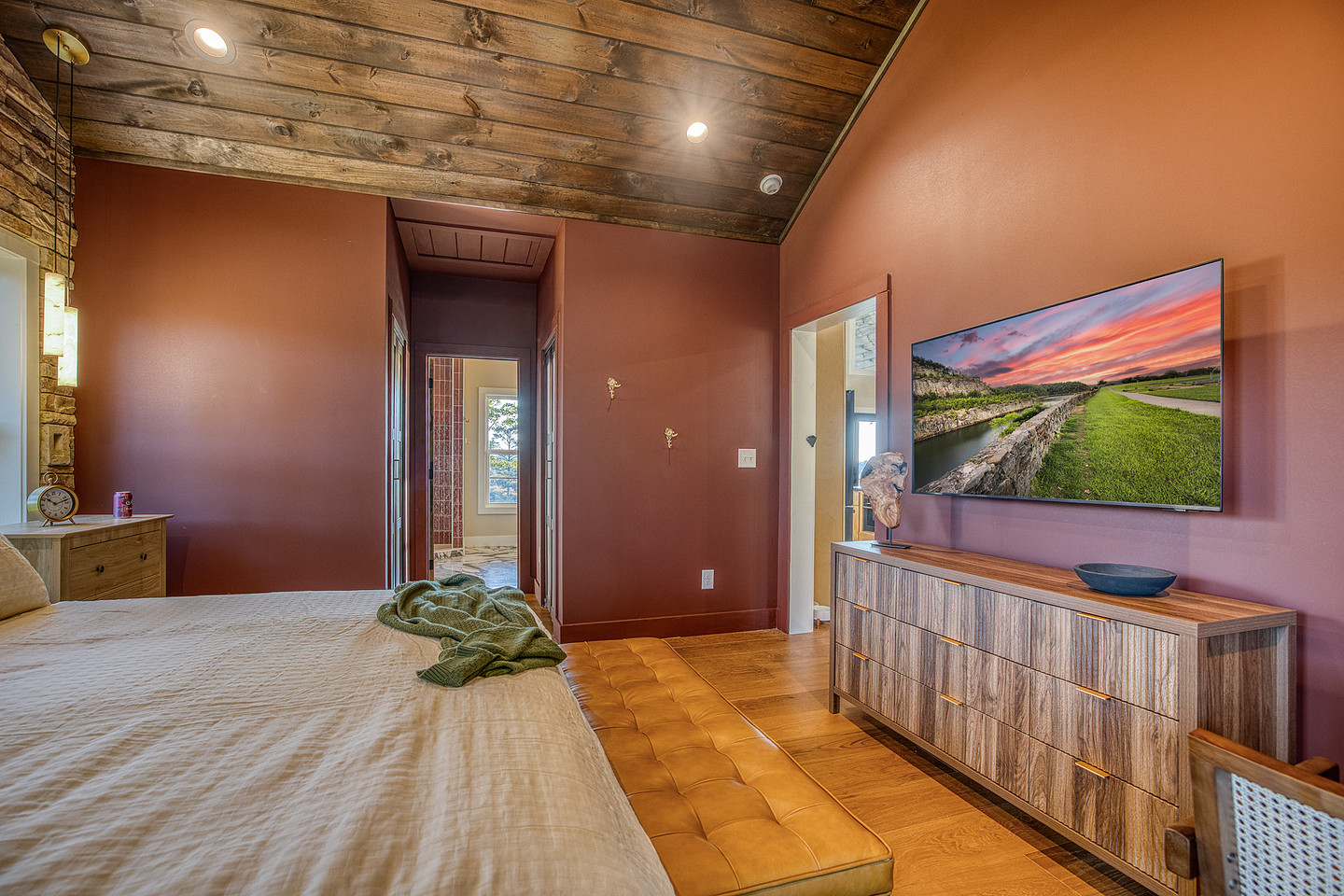 Bedroom with wood ceiling and TV