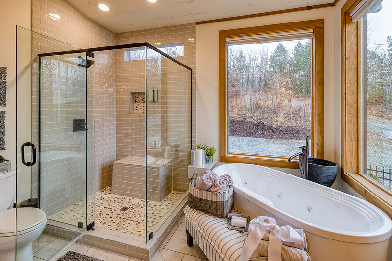 Bathroom with a glass shower and soaking tub, real estate photography in North Georgia