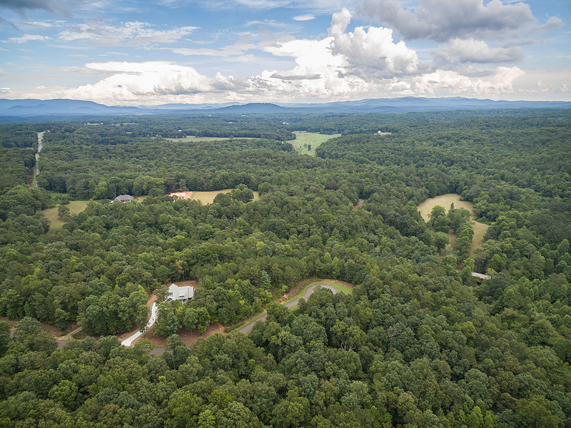 Aerial drone view of wooded acreage and mountains, real estate photography in North Georgia
