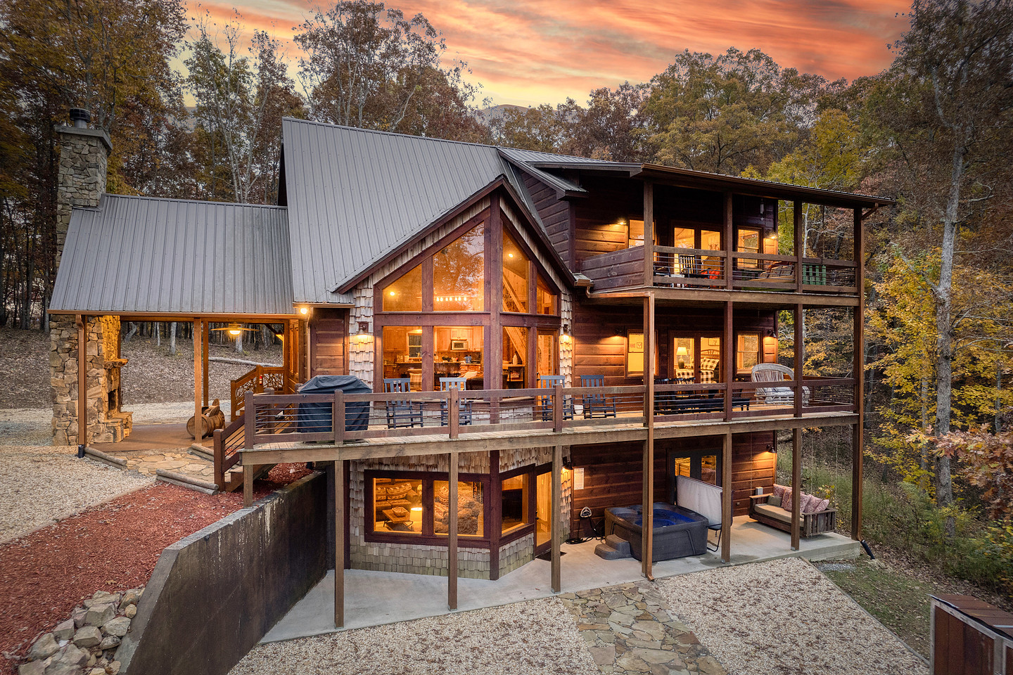 Blue Ridge mountain cabin at twilight with glowing windows, photographed by Broadcast Pro Photo