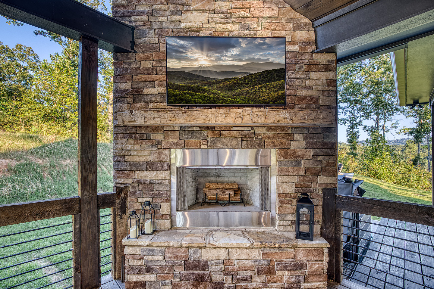 Covered porch with outdoor stone fireplace