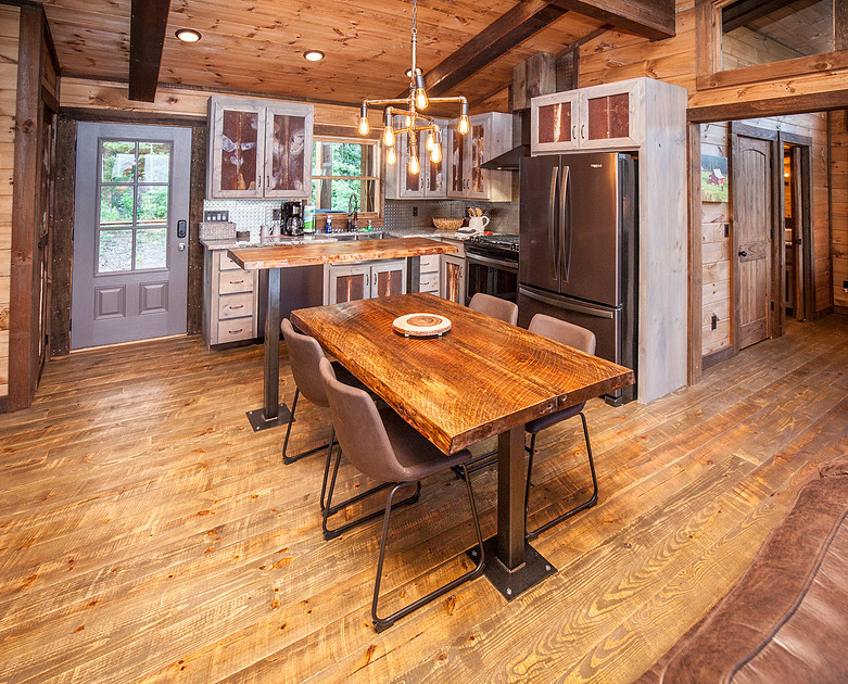 Rustic kitchen and dining area with a live-edge table, real estate photography in North Georgia