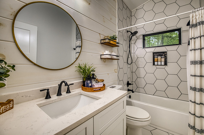 Modern bathroom with a hexagon tile shower, real estate photography in North Georgia